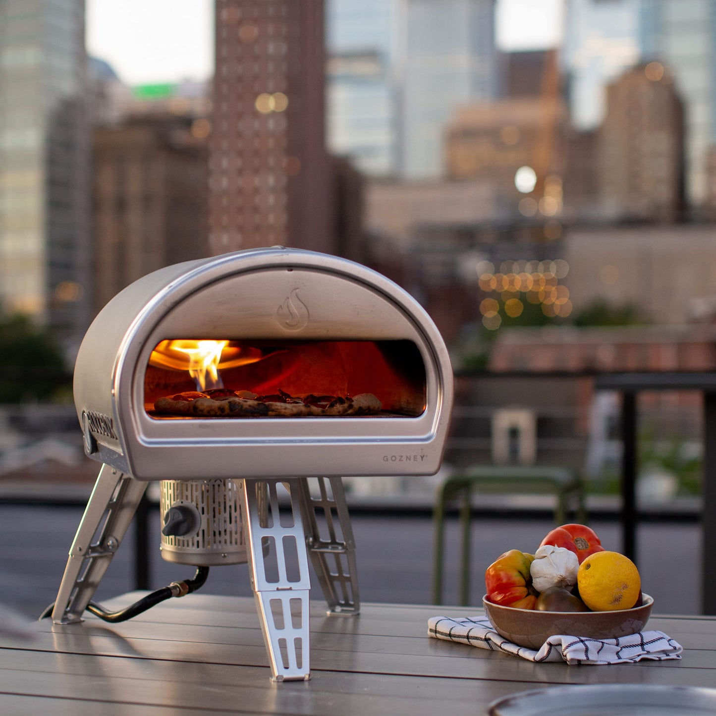 ROCCBOX Gozney Portable Outdoor Pizza Oven - Includes Professional Grade Pizza Peel, Built-In Thermometer and Safe Touch Silicone Jacket - Propane Gas Fired, With Rolling Wood Flame - Grey
