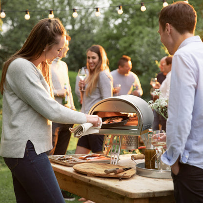 ROCCBOX Gozney Portable Outdoor Pizza Oven - Includes Professional Grade Pizza Peel, Built-In Thermometer and Safe Touch Silicone Jacket - Propane Gas Fired, With Rolling Wood Flame - Grey