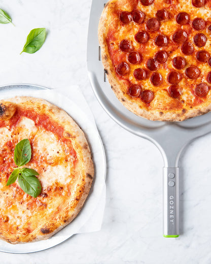 ROCCBOX Gozney Portable Outdoor Pizza Oven - Includes Professional Grade Pizza Peel, Built-In Thermometer and Safe Touch Silicone Jacket - Propane Gas Fired, With Rolling Wood Flame - Grey